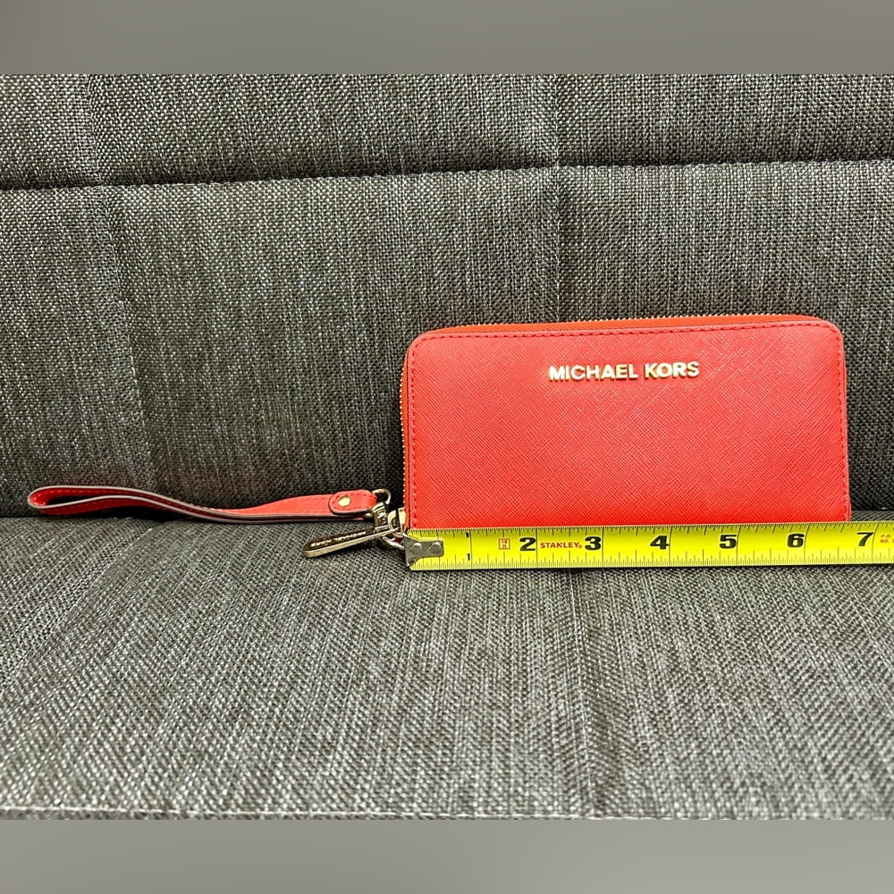 Orange Michael Kors wallet.
